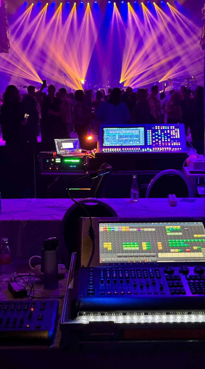 services-04 Dynamic concert scene with colorful stage lights and sound equipment.